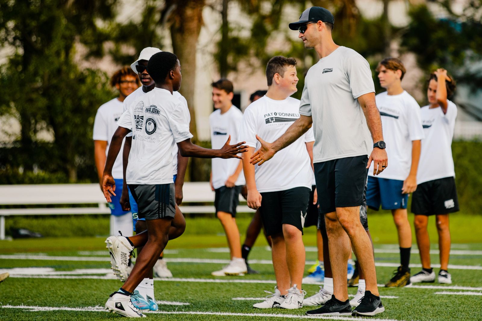 Pat O'Donnell with a young athlete at a training camp