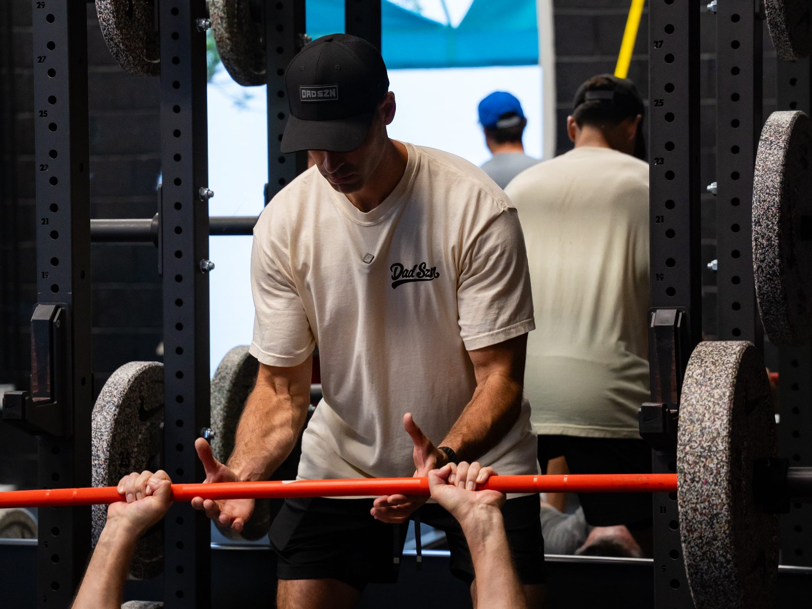 Pat O'Donnell coaching an athlete through a lift at the Sixteen Elite gym